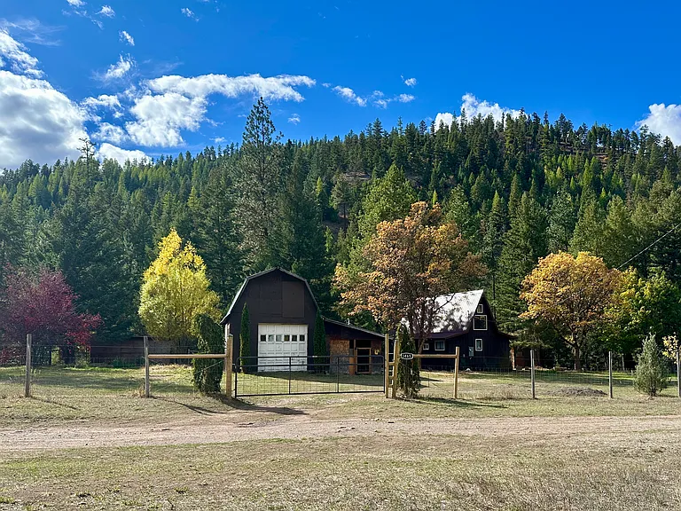 Property backs to state land. Fenced yard.