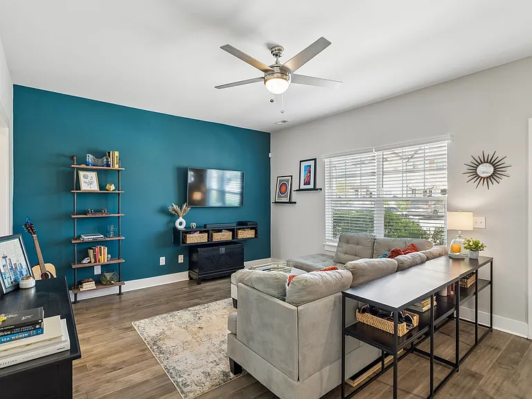 Spacious living area with an open floor plan, perfect for relaxing or entertaining.