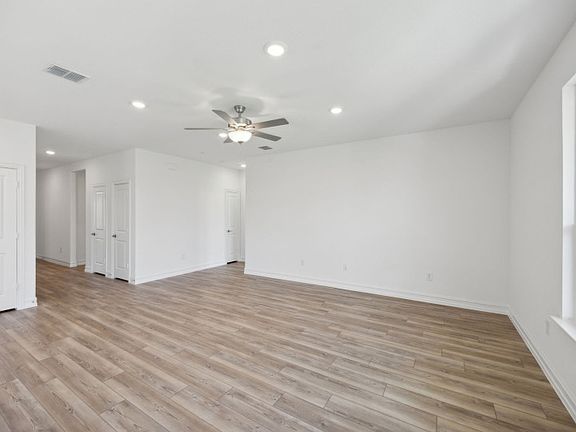 Sunbathed gathering room with expansive windows