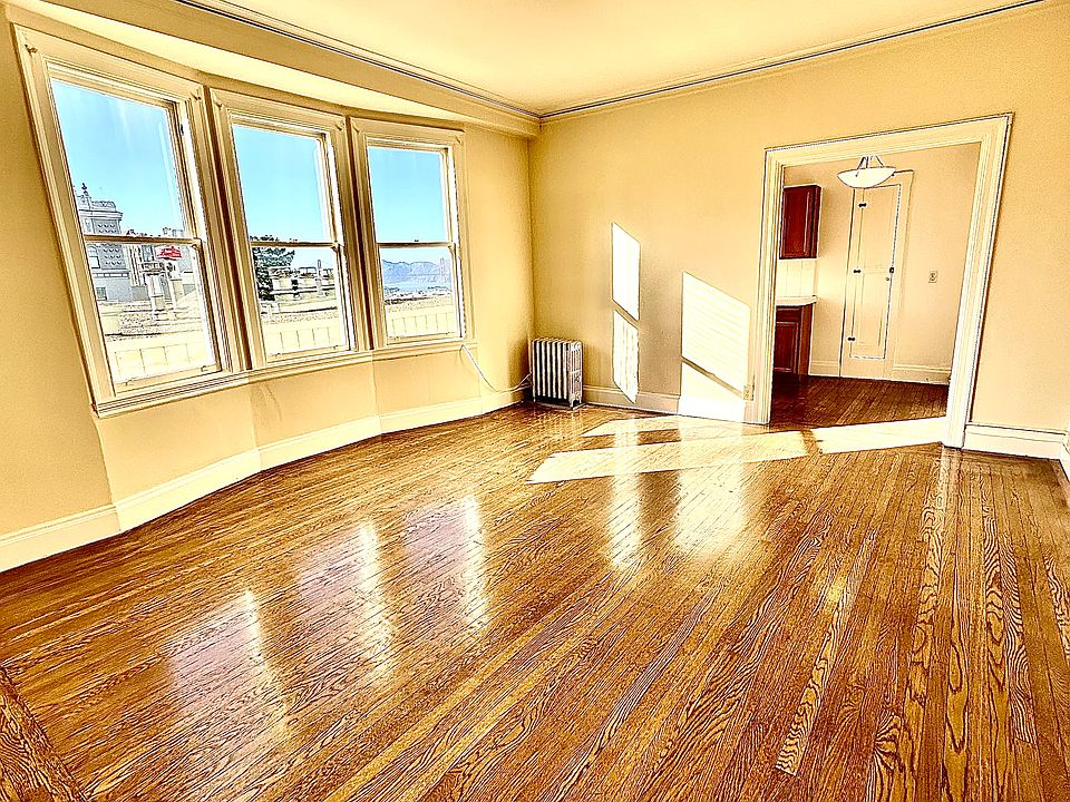 Unit #503 HUGE living room with gorgeous large bay windows!