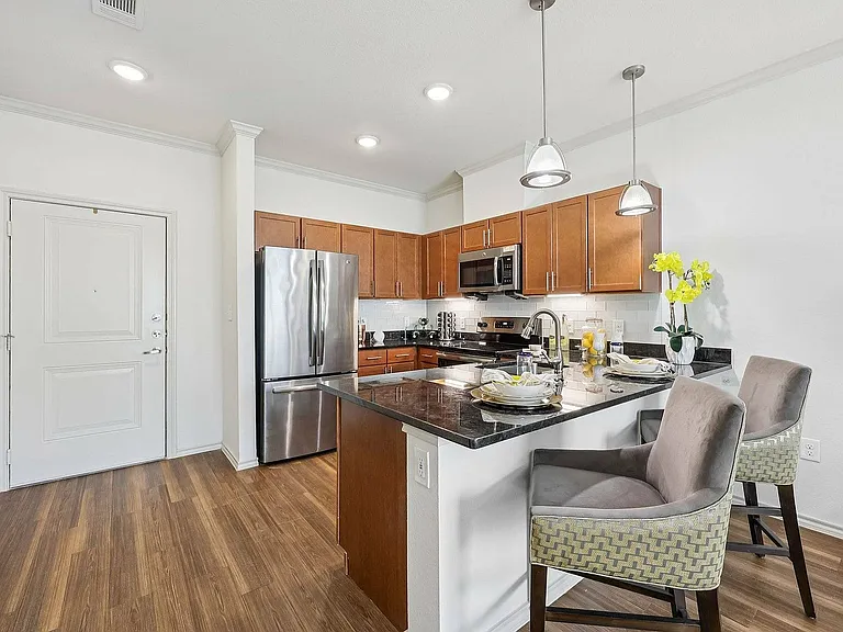 Host friends and family in style with a spacious kitchen island at McDermott 55.