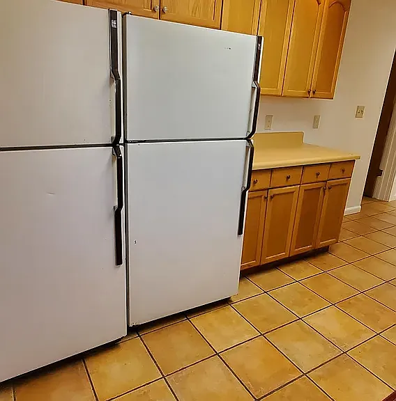 kitchen area. 2 refrigerators