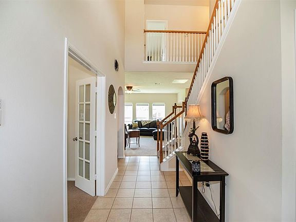As you enter the home you are welcomed with a grand two story entryway.