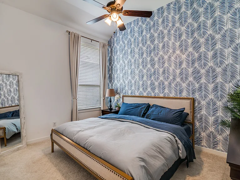 First bedroom with a walk-in closet.