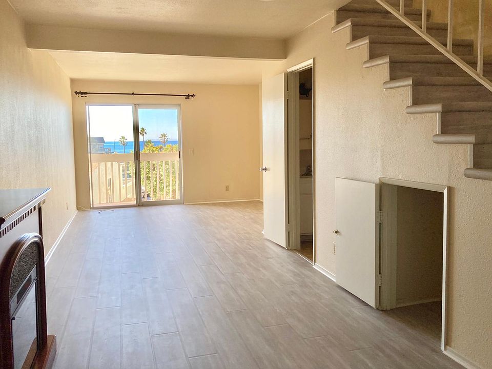 Living room 1/2 bath & extra storage under stairs. Picture is taken from the Kitchen.