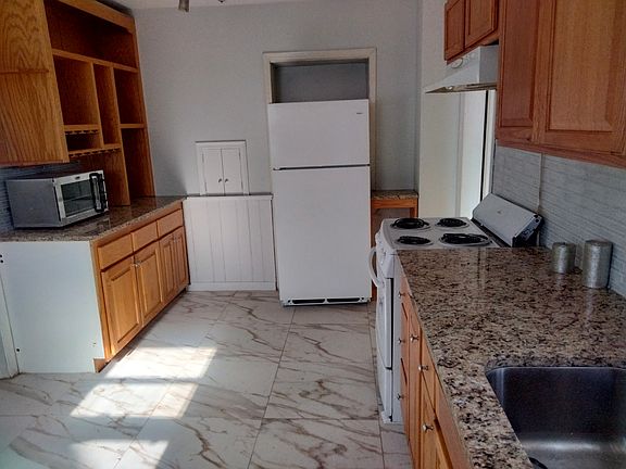 Kitchen upgraded - new tile on a floor and new granite countertops