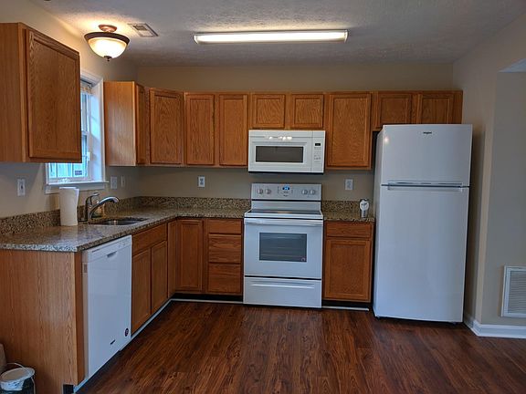 Kitchen with new appliances and granite counter-tops.