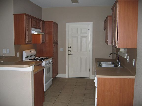 Recently replaced dishwasher and refrigerator with ice maker. Gas range, disposal included