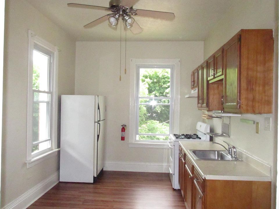 Kitchen is equipped with refrigerator and gas stove. Has access to deck from kicthen.