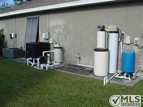 From l-r A/C condensor, pool equipment with heater and water equipment.