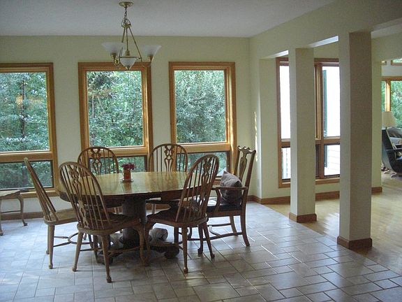 large kitchen and dining next to entrance hall--open to light and ventilation