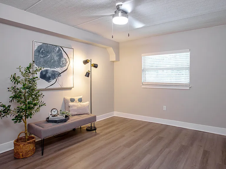 With modern wood-style flooring, natural light, and sleek ceiling fan, our bedrooms offer a perfect retreat to unwind after a long day.