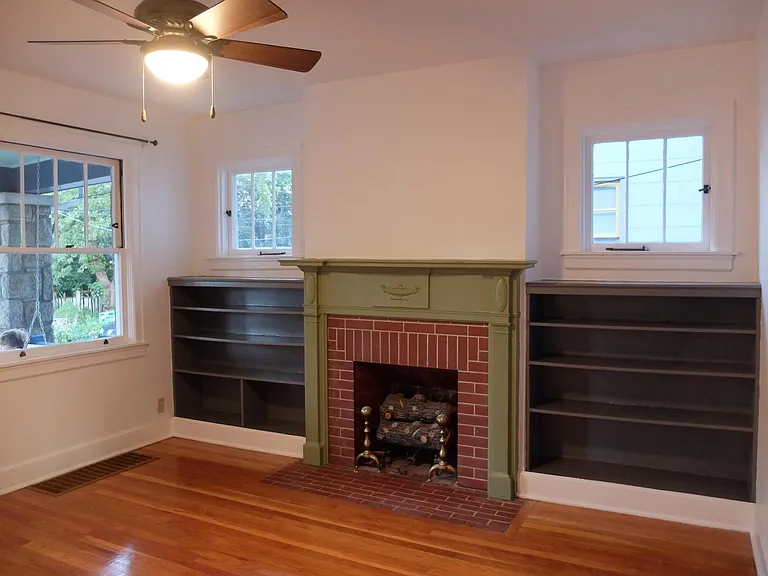 Large window on the left looks out onto the porch and Baldwin Ave.