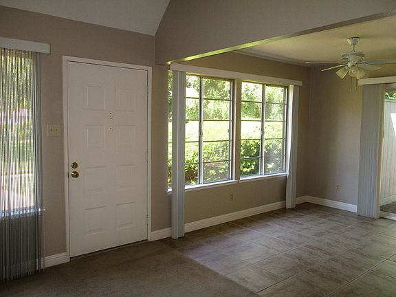 Front entry with lots of natural light overlooking greenbelt