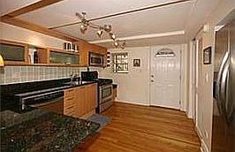 Kitchen leading to back patio