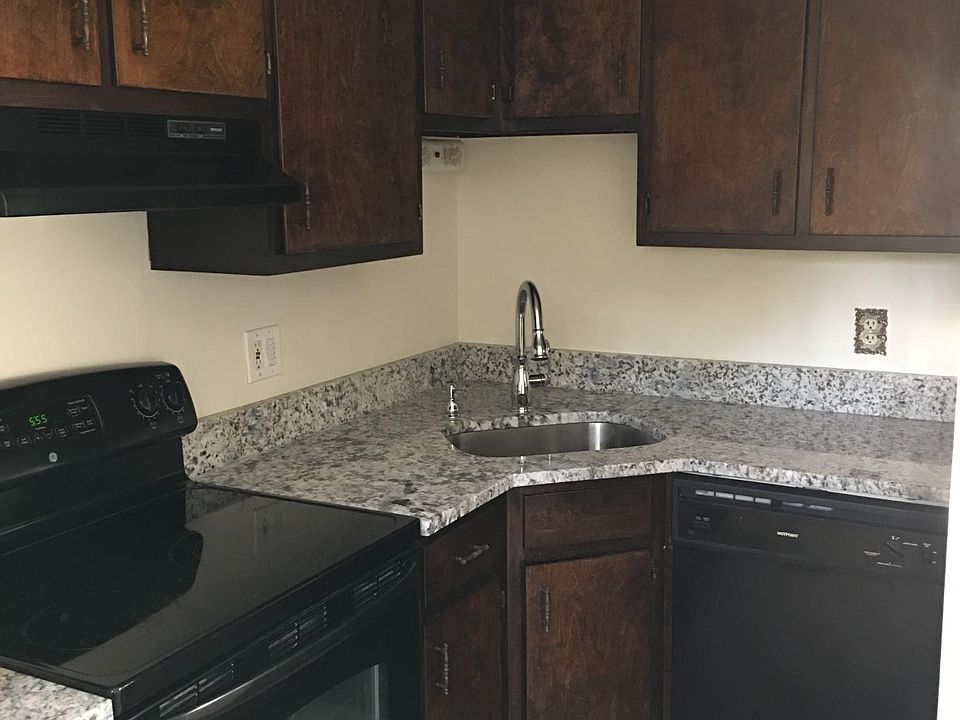 Kitchen - Brand new granite counter tops, resurfaced cabinets and brand new floor tile.