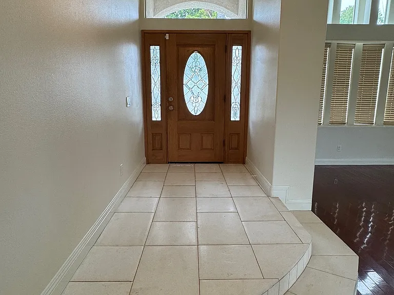 Foyer entrance with Glass Wooden door and Limestone Entry