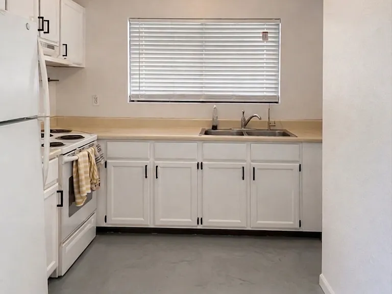 Kitchen! New appliances. The flooring is currently under construction to be a polished concrete. This flooring represents the inspiration for what the flooring will look like.