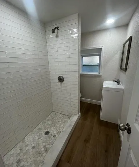 Beautifully updated bathroom with a huge shower and new fixtures.