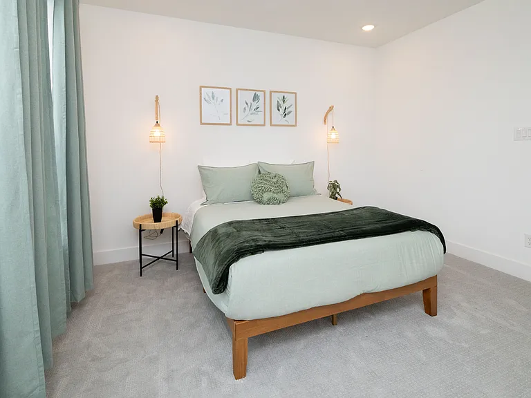 Bedroom #2 has a queen bed with extra pillows and blankets available