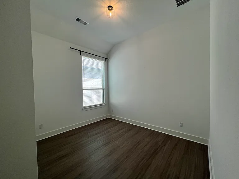 One of 3 guest bedrooms. All large sized for a queen bed.
