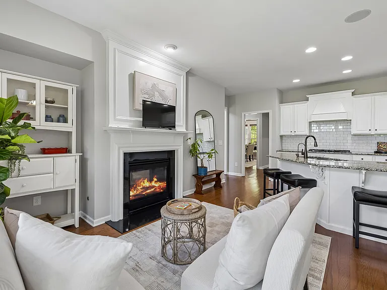Offering exceptional storage, prep space, and seating, the kitchen is thoughtfully designed to keep the chef connected to the home's surrounding gathering spaces.