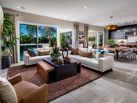 Great room and luxury outdoor living space are accessible to the kitchen