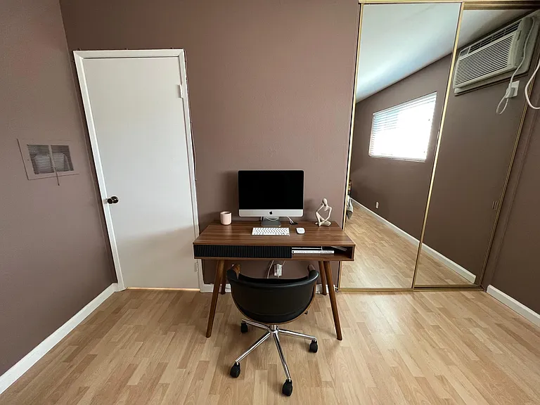 Please note: Pre-renovation photo shown for layout reference. Brand-new flooring has since been installed.