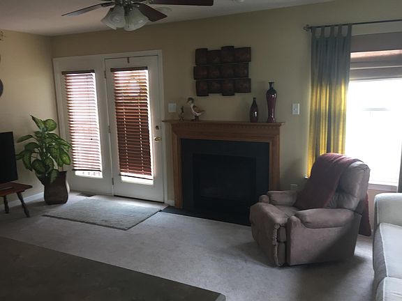 Living Room, fireplace, backdoor exit.