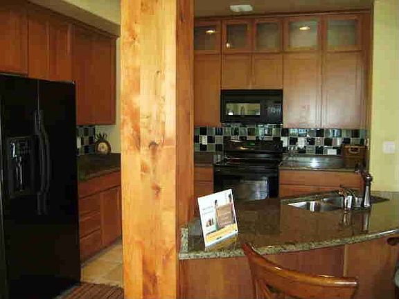 Classy kitchen with large island, granite tops and tons of upgrade options