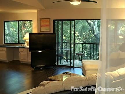 Living area with media center
						:
						Great room enhanced by removing wall to the bedroom and wood floors.