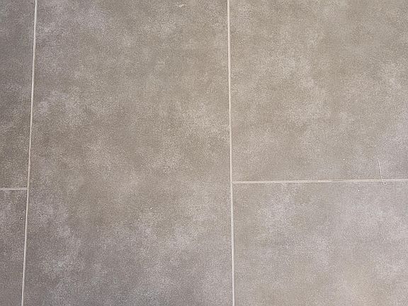 Tile flooring in master bathroom and closet