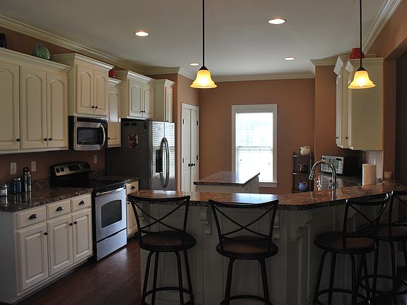 Kitchen with sitting bar.