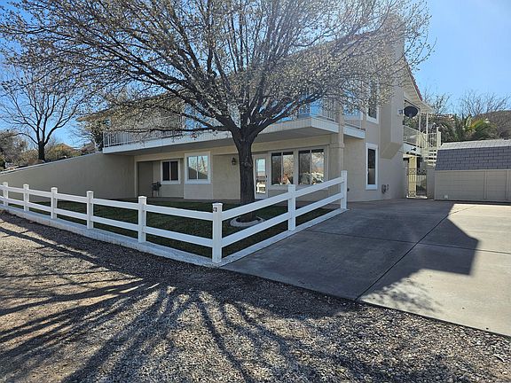 Front of ADU with Private Driveway and Storage Shed.