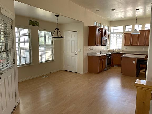 Dining room to kitchen. Door to backyard.