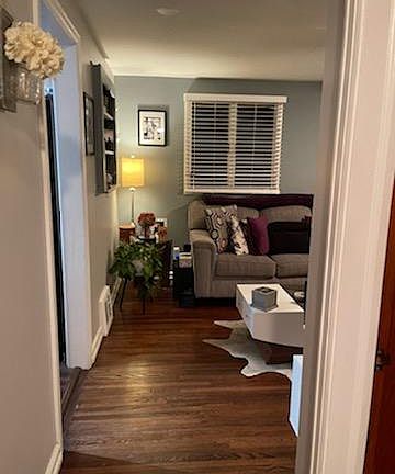 Hallway that connects the living room to the bathroom and two other bedrooms.