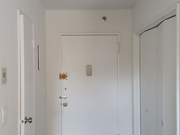 Entry way with new LED light fixture, and large storage clos