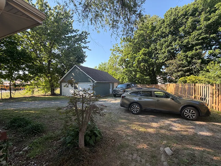 Backyard with plenty of offstreet parking, three car garage with second floor loft storage