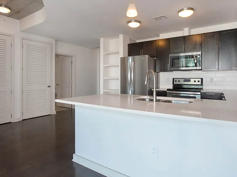 Kitchen with Stainless Steel Appliances and Quartz Countertops