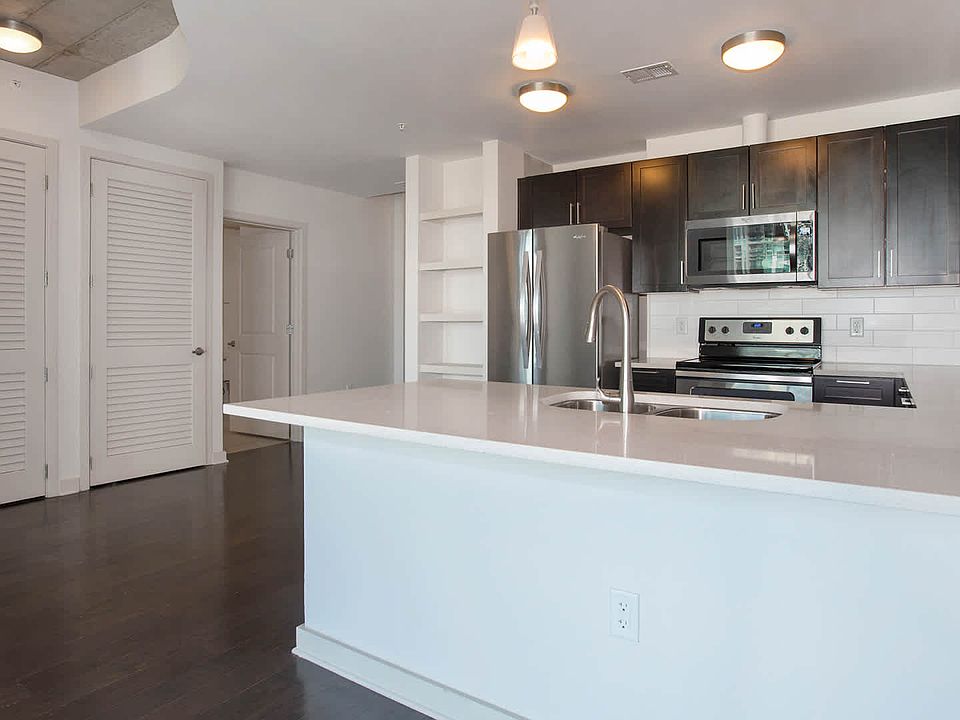 Kitchen with Stainless Steel Appliances and Quartz Countertops