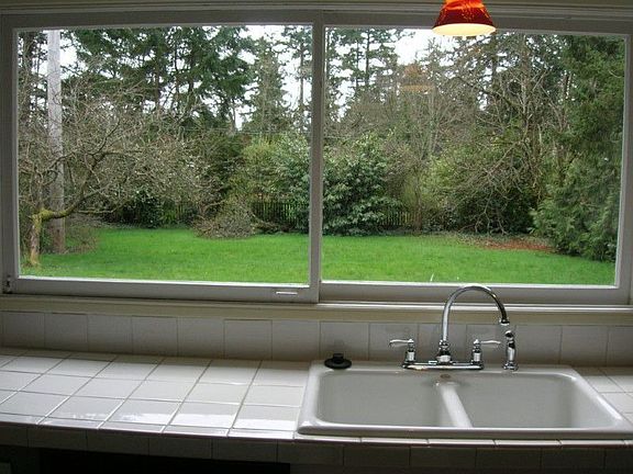 Lovely territorial view from kitchen of large fenced backyard
