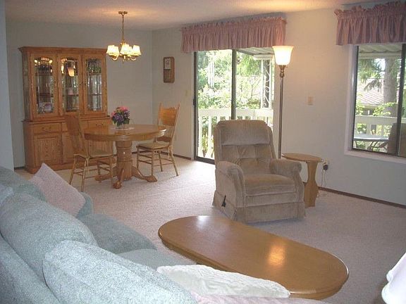 Attached living and dining with doors to the back deck