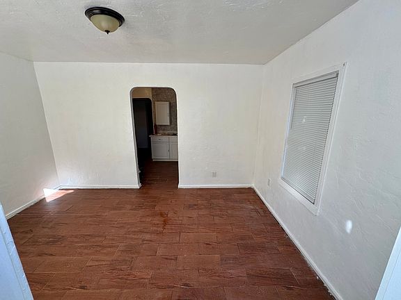 View from front door into the front room and kitchen.