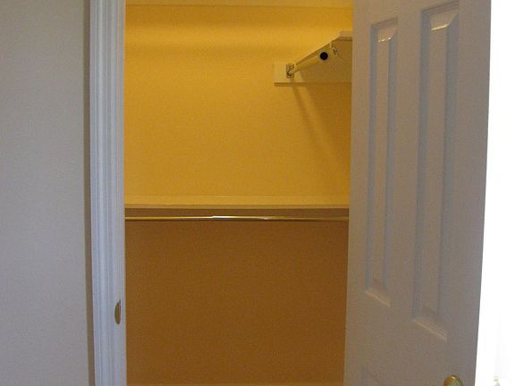 Walk in closet in main larger bedroom.