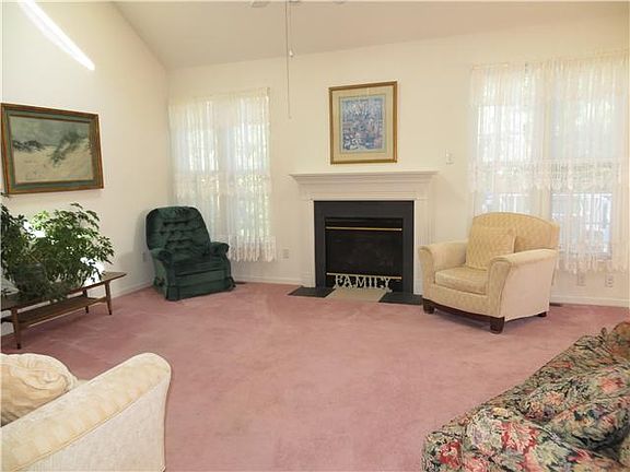 Sunny living room has tons of windows