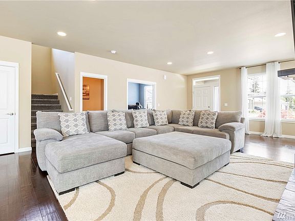 Open concept Living Room.Plenty of Large Windows for Natural Lighting . 1/2 Bath & 4th Bedroom in Back Ground.
