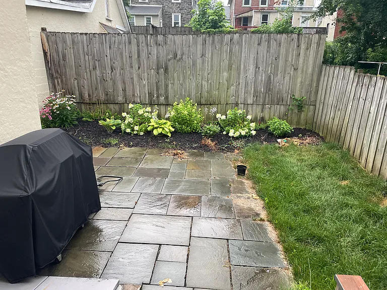Fenced in back yard. Flagstone Patio