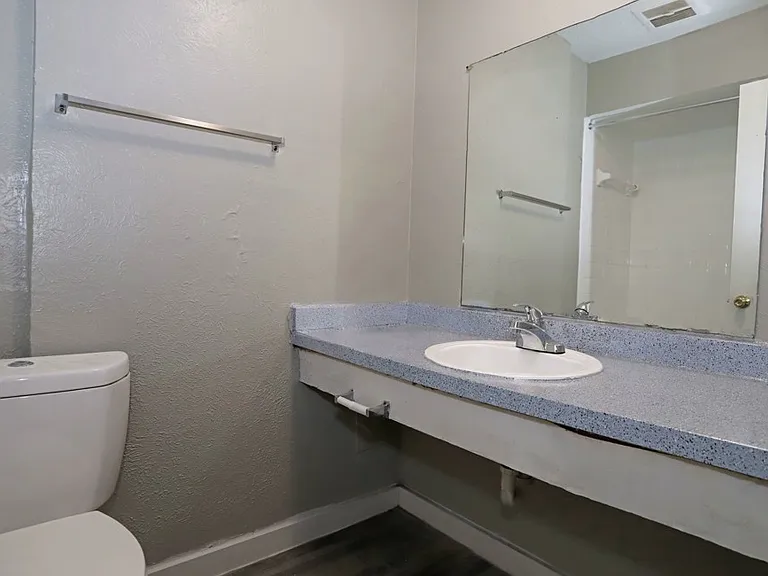 Clean and modern bathroom with vanity lighting and updated finishes.