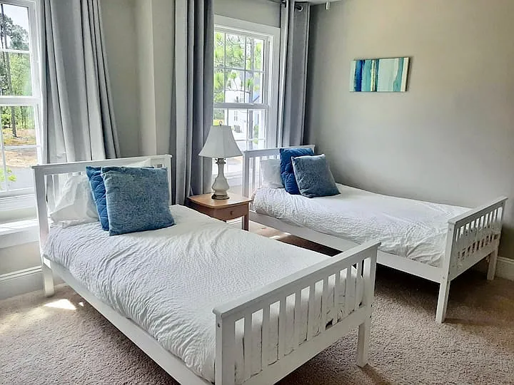 1st bedroom with walk-in closet and bench seat.