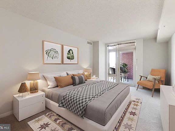 Large primary bedroom with access to balcony